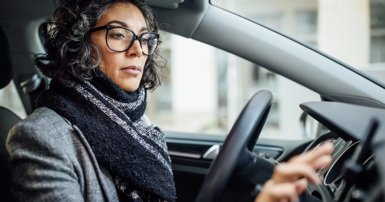 An illustration showing a woman in a car.